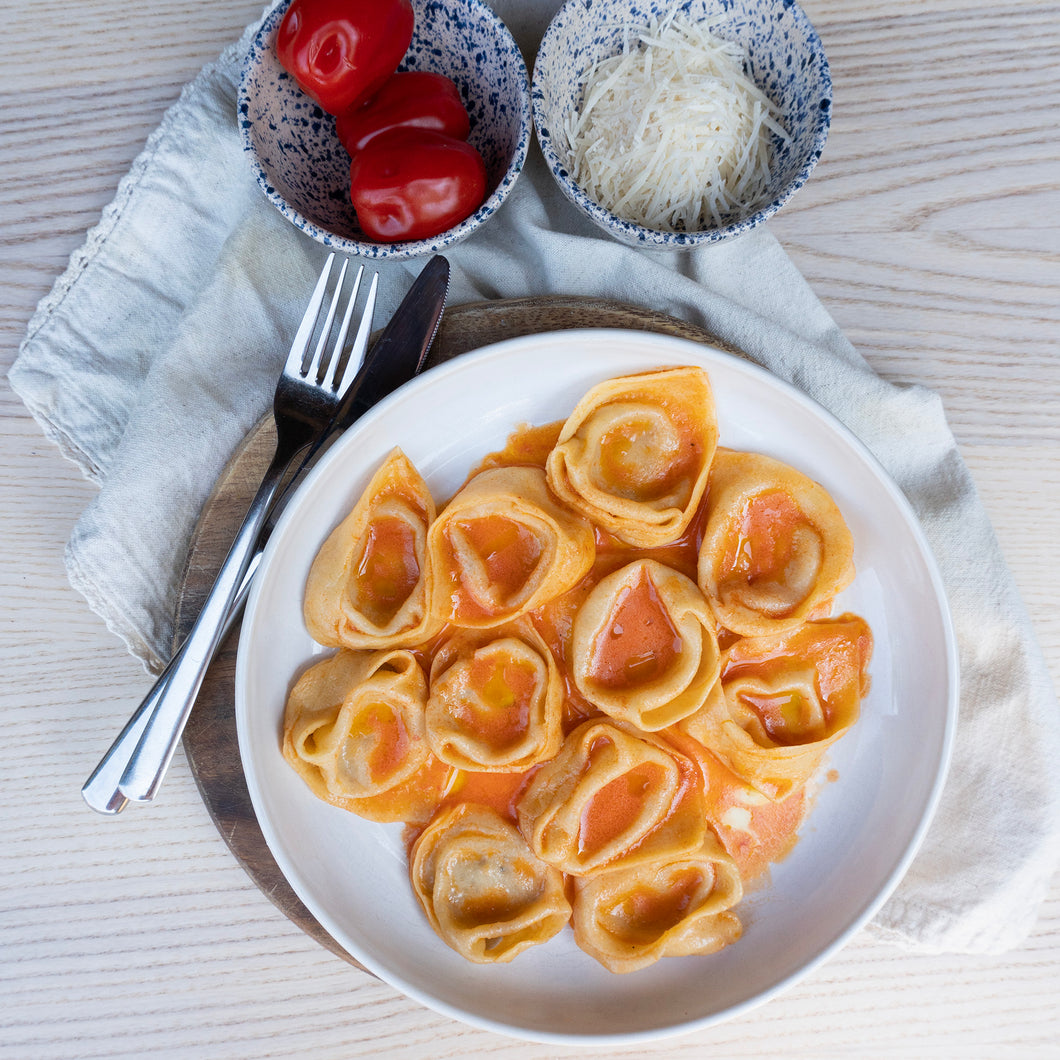 Tortelloni cacio e pepe with cherry tomato nectar butter